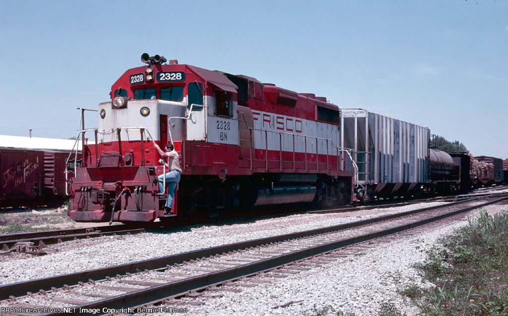 Burlington Northern GP38-2 #2328 putting together its train, the Columbus, MS turn, in the yard 